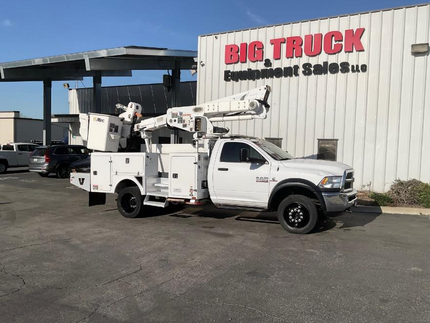 Dodge Ram 5500 Altec utility bucket truck parked outdoors