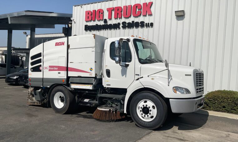 A 2015 Freightliner M2 CNG Elgin Broom Bear Mechanical Street Sweeper