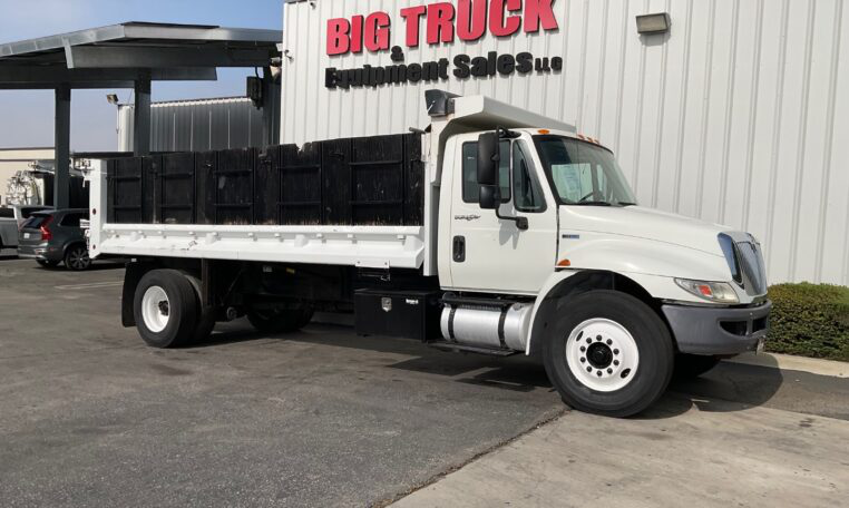 A 2012 International 4300 19' Stakebed Dump Truck