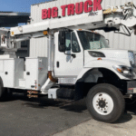 A 2016 International 7300 4x4 Altec DM47B TR Digger Derrickby Big Truck & Equipment Sales