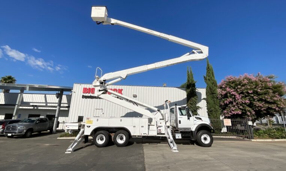 Bucket truck in action during tree service work