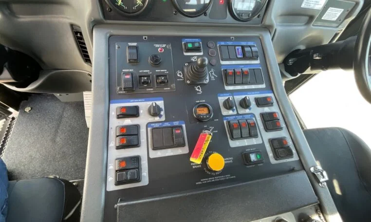 operating buttons inside a 2019 Elgin Pelican CNG Street Sweeper