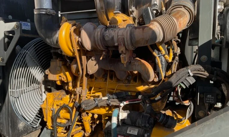 pipes on the side of the 2017 Freightliner M2 Elgin Eagle Waterless Street Sweeper