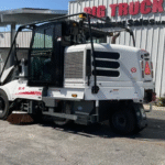 2019 Elgin Pelican CNG Street Sweeper parked outside in the sun