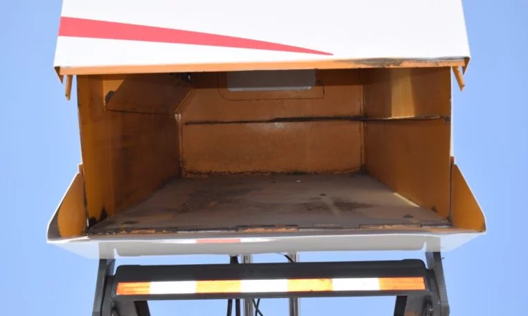 close-up of a 2008 Sterling Acterra Elgin Broom Bear CNG Mechanical Street Sweeper