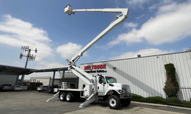 A 2015 International 7400 6x6 Altec A77T-E93 98' Bucket Truck by Big Truck & Equipment Sales