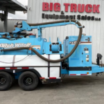 2014 Ditch Witch FX60 hydro excavation vacuum trailer at a construction site.