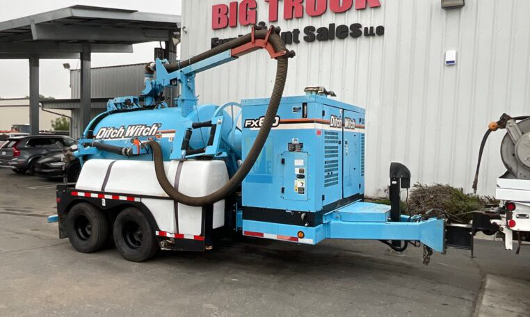 2014 Ditch Witch FX60 hydro excavation vacuum trailer parked outdoors.